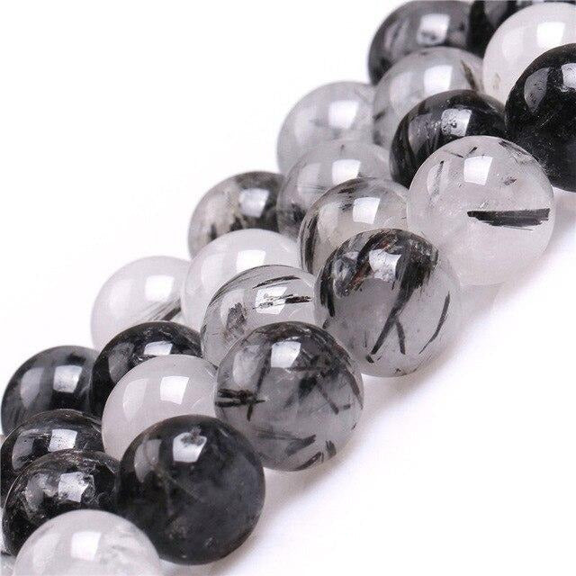 Round tourmalinated quartz beads