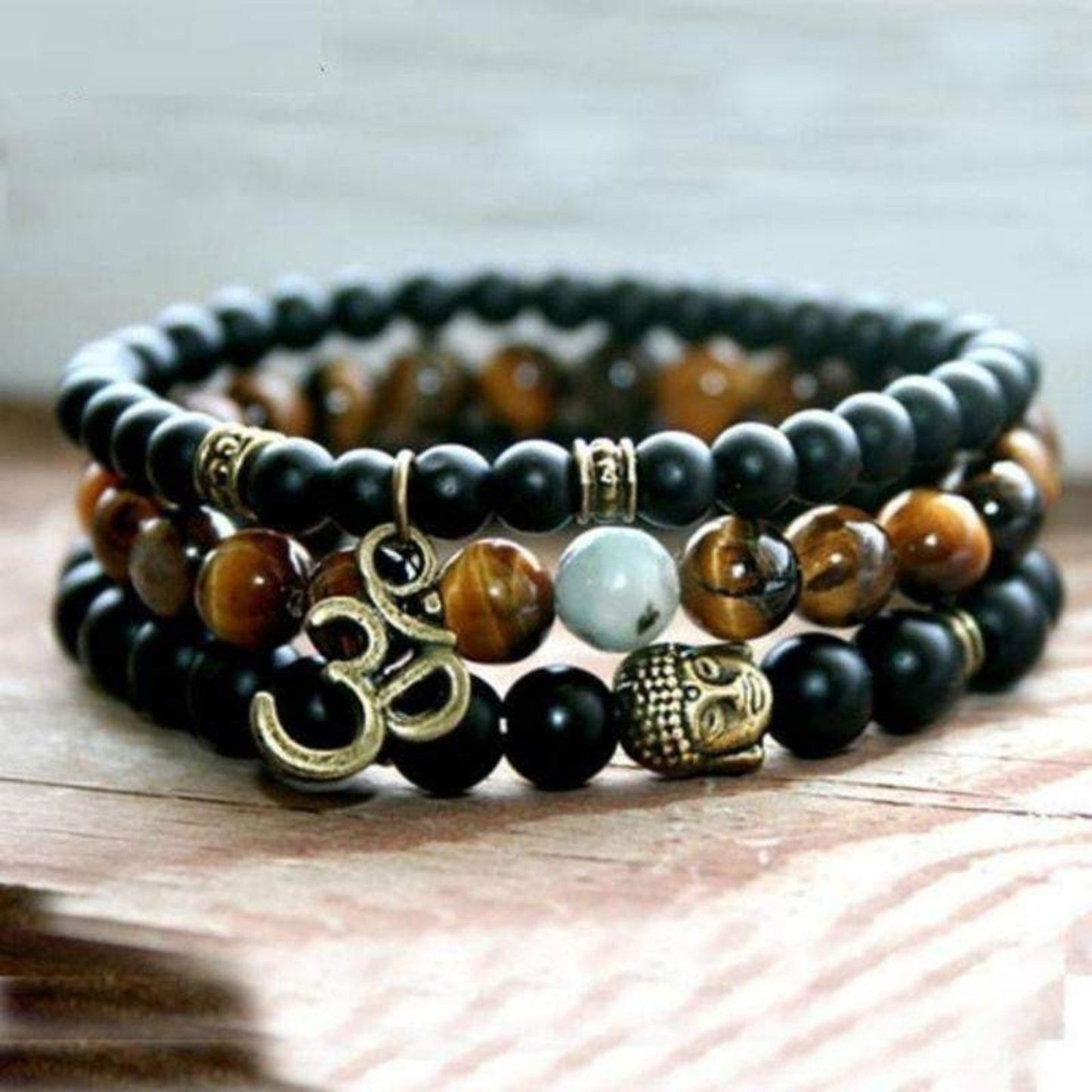 Buddha OM bracelets in matte black onyx and tiger eye
