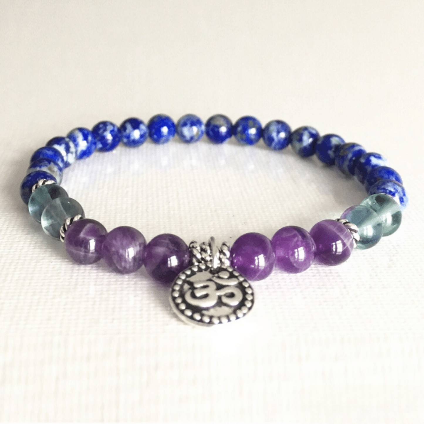 OM bracelet in lapis lazuli, green fluorite and amethyst