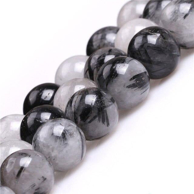 Round tourmalinated quartz beads