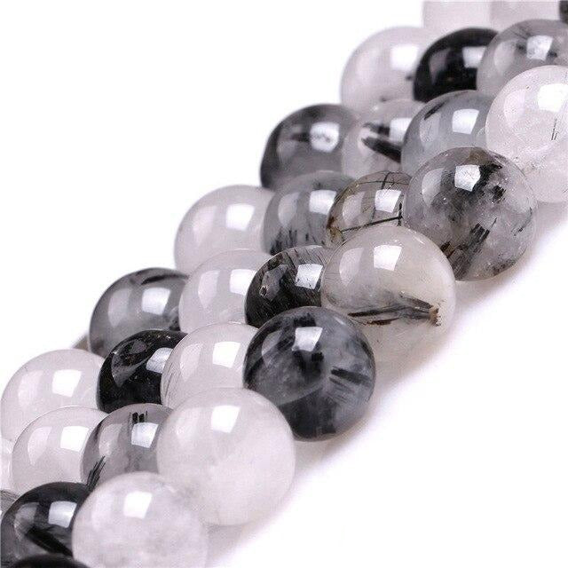 Round tourmalinated quartz beads