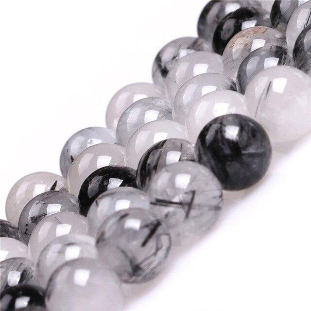 Round tourmalinated quartz beads
