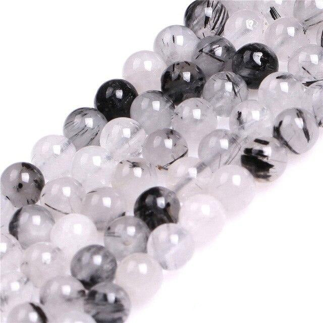 Round tourmalinated quartz beads